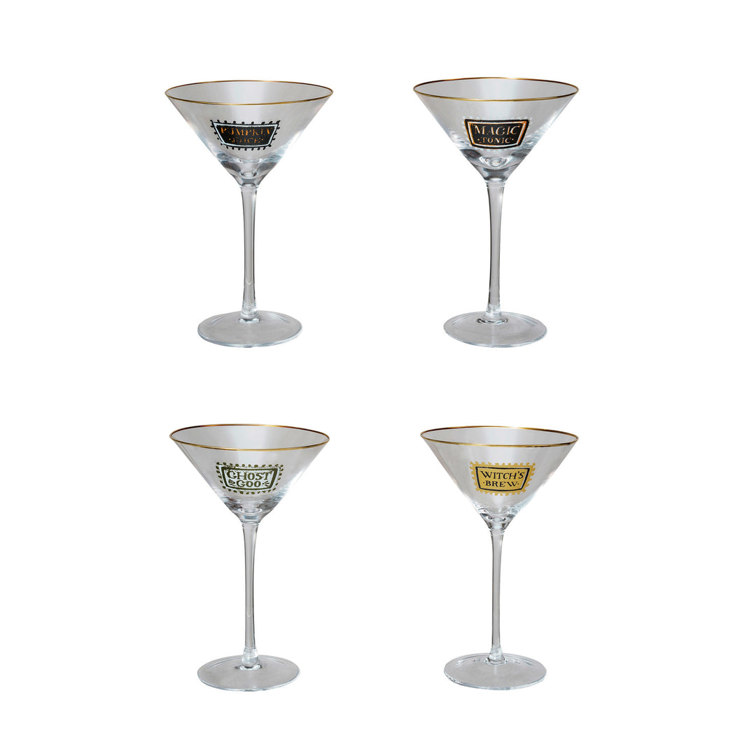 Four clear martini-style cocktail glasses arranged in a 2x2 grid on a white background. Each glass has a thin gold rim and a decorative label near the bowl: Magic, Gold Coin, and Whiskey are visible.