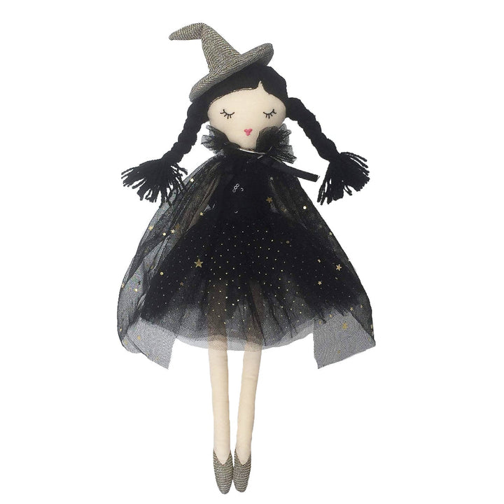 Toy doll dressed as a witch with a black dress and hat on a white background