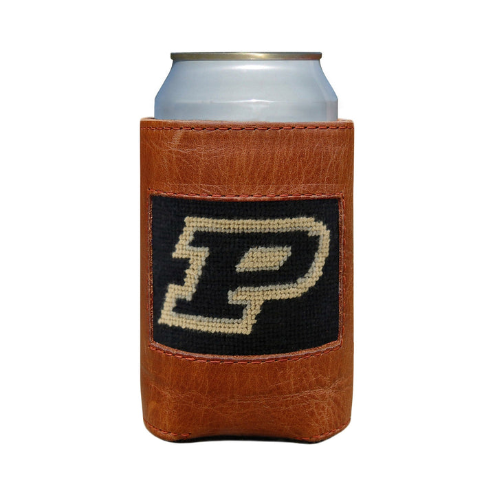 A brown leather can cooler with a hand-stitched needlepoint design, featuring a 'P' logo, containing a can.