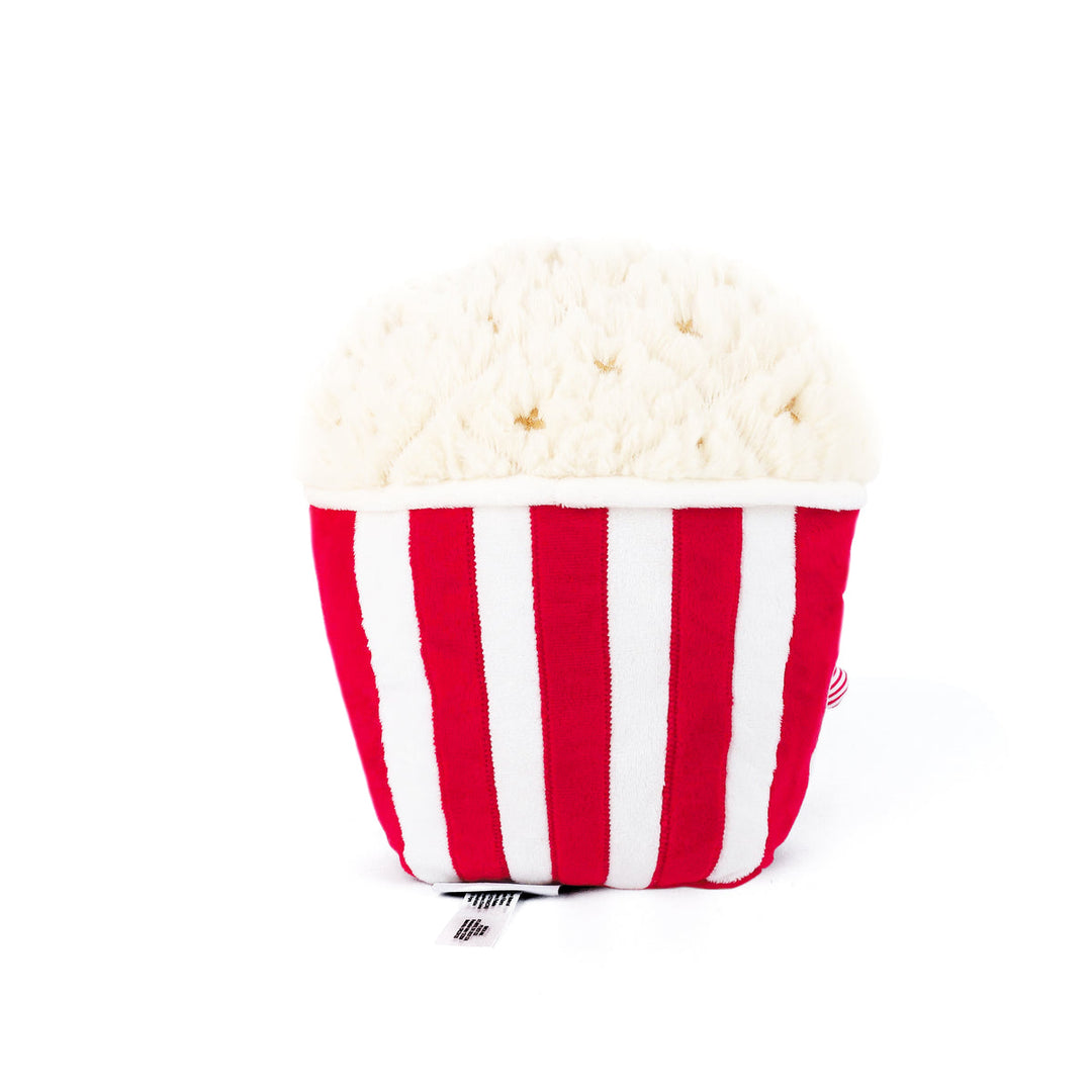 A plush popcorn-shaped cushion or pillow with red and white vertical stripes and a cream-colored fluffy top, photographed on a clean white background.