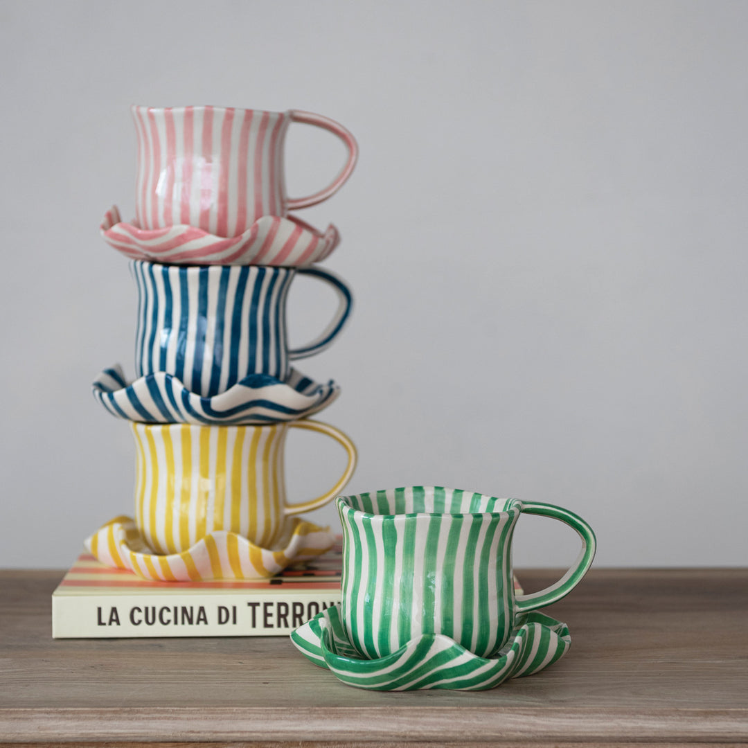 Hand-painted mug with ruffled saucer, styled view