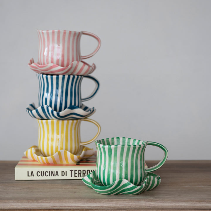 Hand-painted mug with ruffled saucer, styled view