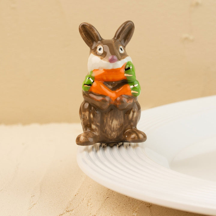 Funny Bunny Mini by Nora Fleming — hand-painted ceramic bunny hugging its carrot