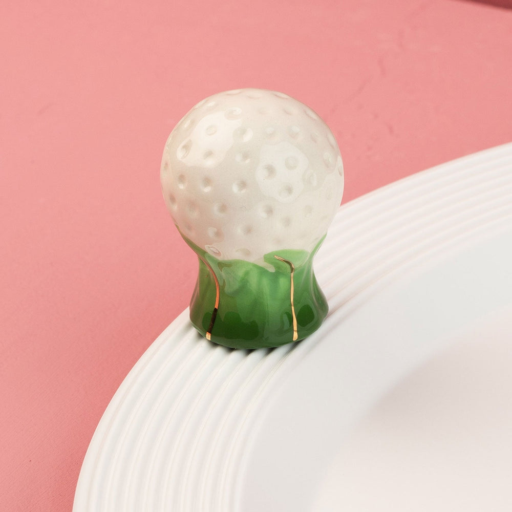Hole in One Mini by Nora Fleming — hand-painted ceramic golf ball on its tee (alternate view)