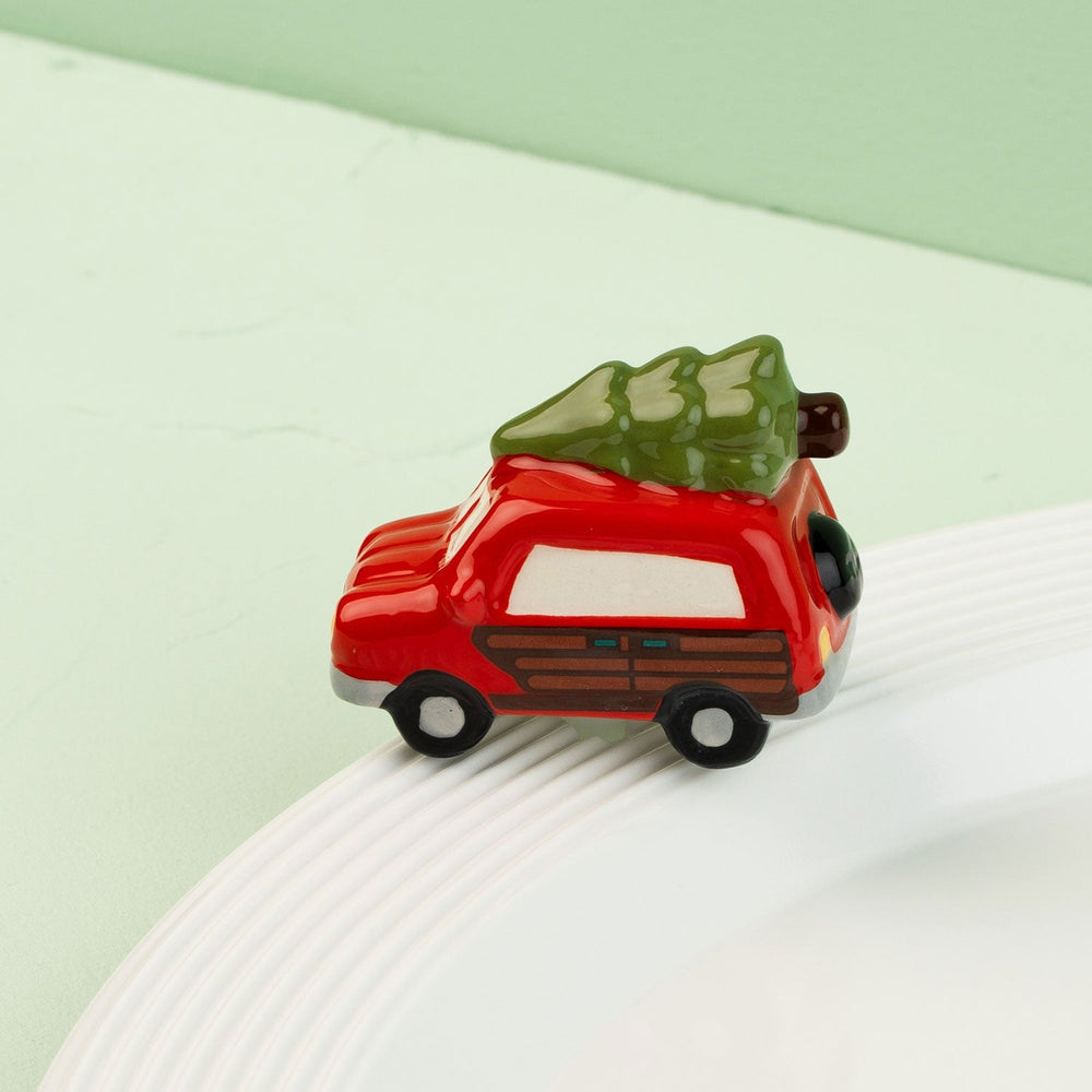 Just like the Griswold's Mini by Nora Fleming — hand-painted ceramic station wagon with the tree strapped on top (alternate view)