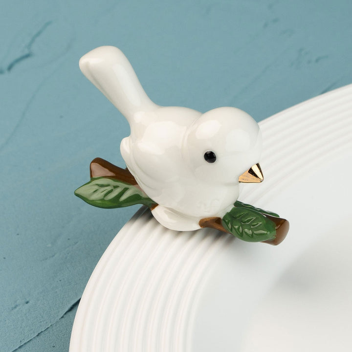 Love Dove Mini by Nora Fleming — hand-painted ceramic white ceramic bird on a branch (alternate view)