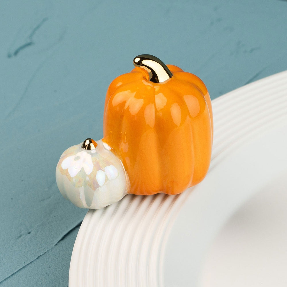 Pumpkin Spice Mini by Nora Fleming — hand-painted ceramic pair of pumpkins, one orange and one white (alternate view)
