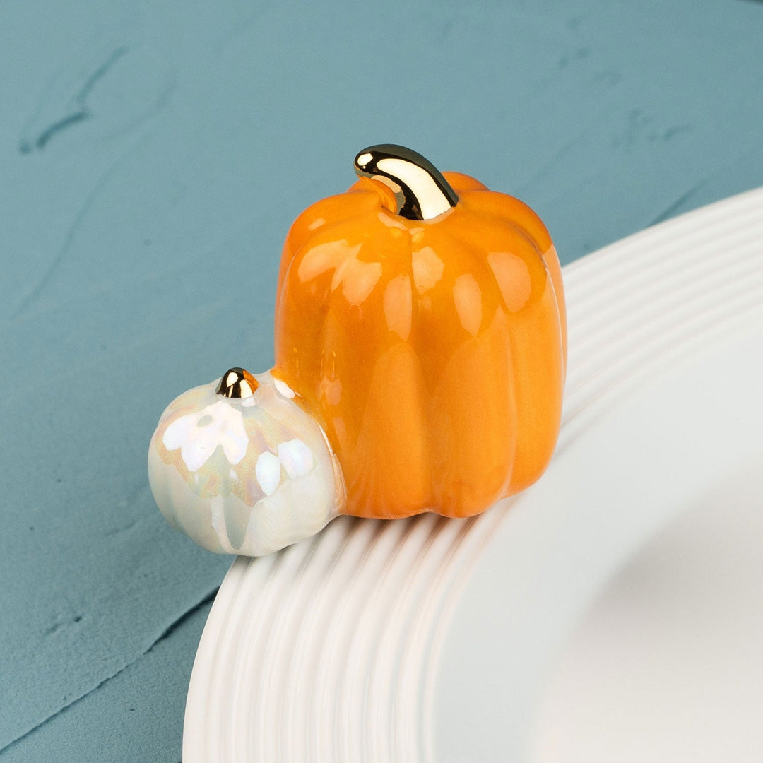 Pumpkin Spice Mini by Nora Fleming — hand-painted ceramic pair of pumpkins, one orange and one white (alternate view)