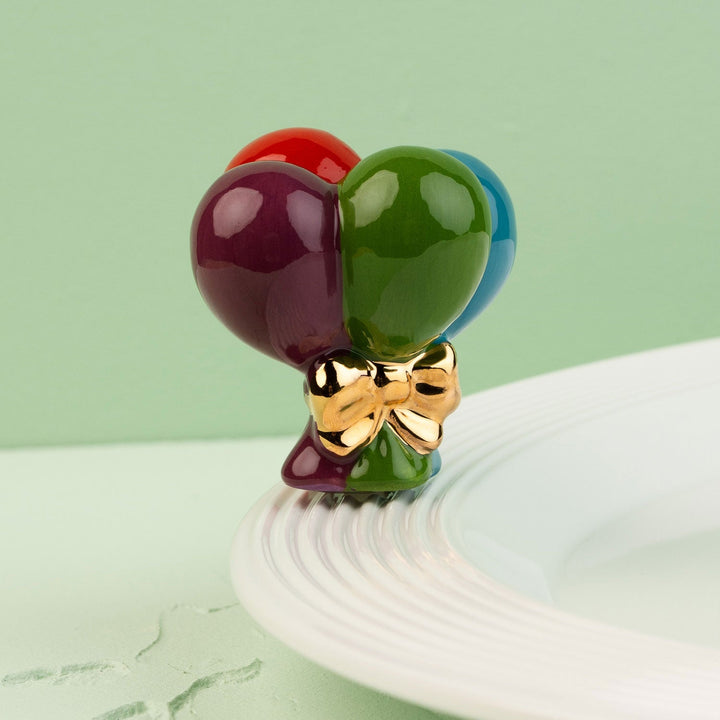 Up, Up, and Away! Mini by Nora Fleming — hand-painted ceramic bundle of balloons with a gold bow