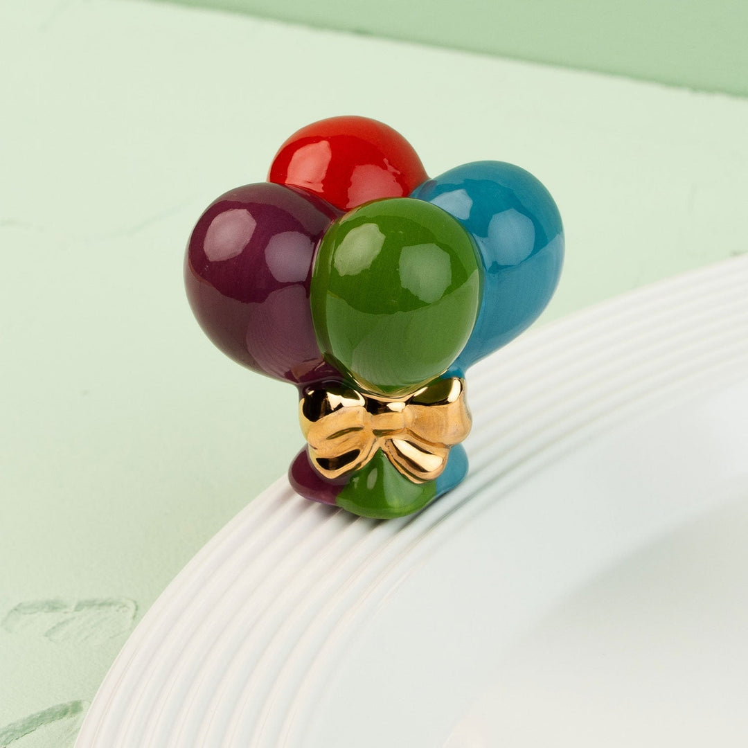 Up, Up, and Away! Mini by Nora Fleming — hand-painted ceramic bundle of balloons with a gold bow (alternate view)