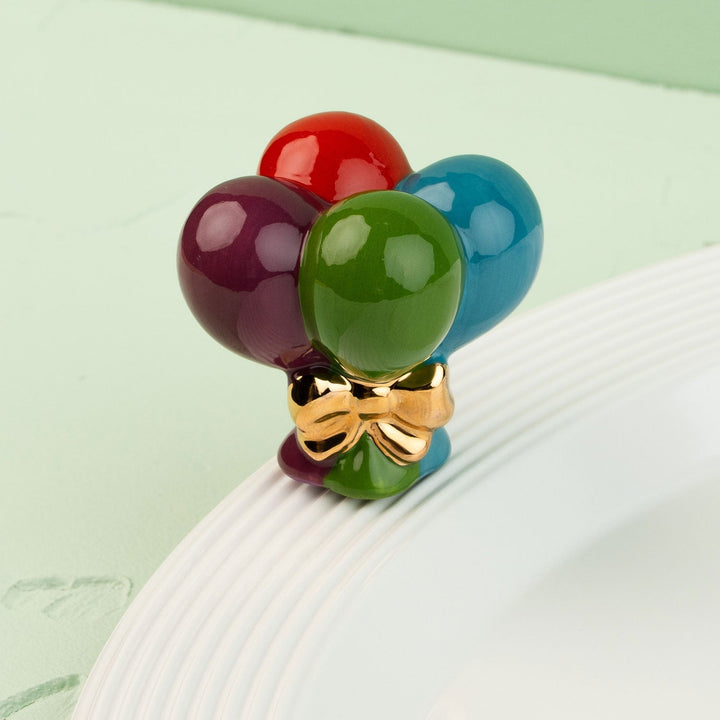 Up, Up, and Away! Mini by Nora Fleming — hand-painted ceramic bundle of balloons with a gold bow (alternate view)